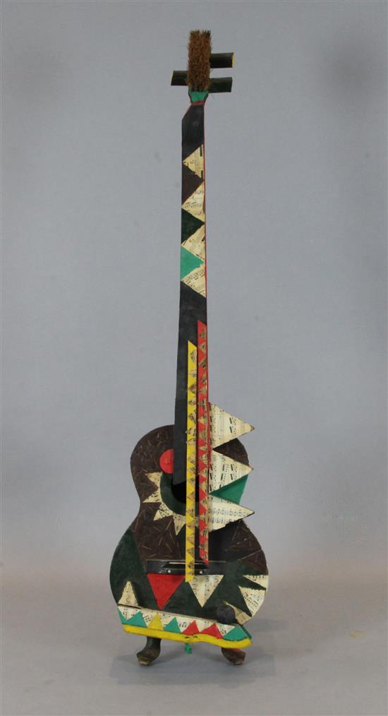 Elton John Collection. A collage and painted wood model of a guitar, height 60in.